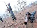 Maoists exercise at a temporary base in the Abujh Marh forests, in Chhattisgarh, in this file photo. AP