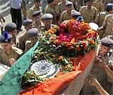 Soldiers carry the bodies of their colleagues killed Chattisgarh Maoist attack, at Lucknow airport on Wednesday. PTI.