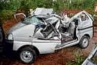 collateral damage: Two people were killed as a tree came crashing on a vehicle near  Kundapur on Thursday. dh photo