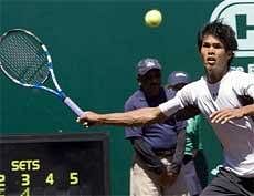 Somdev Devvarman of India hits a forehand against Lleyton Hewitt of Austraiia in a singles tennis match at the US Men's Clay Court Championships at River Oaks Country Club in Houston. AP
