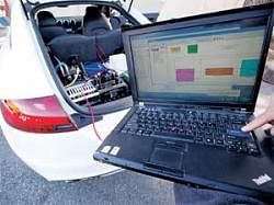 Wonder at its peak: In this photo taken on April 1, 2010, Stanford graduate student Mick Kritayakirana (not seen) uses a laptop computer as he demonstrates the computer system inside a driverless car on the Stanford University campus in Palo Alto, Calif. (AP )