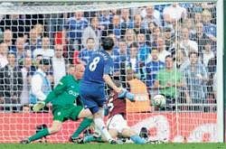 On target: Frank Lampard scores Chelseas third goal during their 3-0 rout of Aston Villa in the FA Cup semifinal at the Wembley stadium in London on Saturday. AP