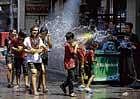 Unmindful of the political turmoil, people spray each other with water guns during the Songkran festival to mark the Thai new year in Khao San, Bangkok, on Tuesday. AFP