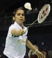 On song:  Saina Nehwal in action at the Asian badminton championships on Wednesday.  AP