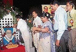 District-in-Charge Minister Krishna J Palemar paying floral tributes to Dr B R Ambedkar on the latters 119th birth anniversary celebrations held at Town Hall in Mangalore on Wednesday. Mayor Rajani Dugganna, MLA U T Khader, Deputy Commissioner V Ponnuraj and others look on.