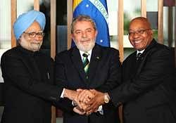 Prime Minister Manmohan Singh, Brazil's President Luiz Inacio Lula da Silva (C) and South Africa's President Jacob Zuma pose for photo session during the IV IBSA Summit in Brasilia on Thursday. AFP