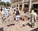 People gather at the site of a bomb blast on the premises of a hospital in Quetta on Friday. AFP
