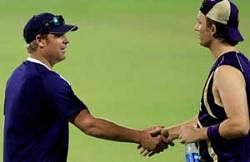 Rajasthan Royals cricketer Shane Warne and Kolkata Knight Riders cricketer Shane Bond exchange greetings during a practice session ahead of their IPL T20 match at Eden Garden in Kolkata on Friday evening. PTI
