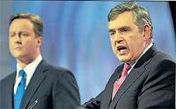 British Prime Minister Gordon Brown (right) and leader of opposition David Cameron at a live TV debate on Thursday. AFP