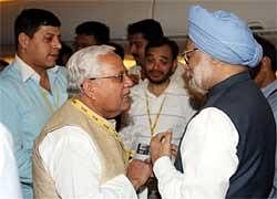 Prime Minister Manmohan Singh interacts with media persons on board his special plane to New Delhi on Saturday. PTI