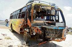 The mangled remains of the private bus that met with an accident near Kolar on Saturday. DH photo