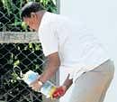 A bomb squad member defuses a bomb near the Chinnaswamy Stadium in Bangalore on Sunday. DH photo/ S K Dinesh
