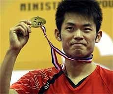 China's Lin Dan poses at the medals presentation ceremony after he defeated China's Wang Zhengming, unseen in the Men's Singles match of the Yonex-Sunrise Badminton Asia Championships 2010 in New Delhi on Sunday. AP