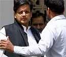 EXIT:  Minister of State for External Affairs Shashi Tharoor comes out after meeting Prime Minister Manmohan Singh at his residence in New Delhi on Sunday. PTI