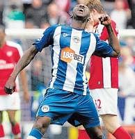 KILLER BLOW: Wigan Athletic's Steve Gohouri exults after his team scored a  shock win over Arsenal in their English Premier League match on Sunday. AP