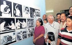 Nostalgic: Geethapriya taking a look at the photographs with his wife.