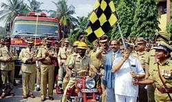 Home Minister V S Acharya flagging off a statewide fire safety awareness campaign in Bangalore on Tuesday. KPN