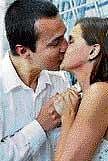 Juraj Hegyi and Zuzana Marcekova kiss during their wedding in a hotel. REUTERS