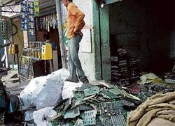 E-waste piled up in the shop of a scrap dealer.