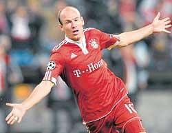 ON A HIGH: Bayerns Arjen Robben celebrates after scoring against Lyon in the Champions League on Wednesday. AP