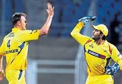 Take that: Chennai Super Kings skipper M S Dhoni and team mate Bollinger celebrate the wicket of Deccan Chargers' Suman during their IPL T20 second semi final match at D Y Patil  Stadium in Navi Mumbai on Thursday. PTI