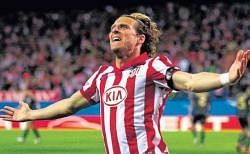 On target: Atletico Madrids Diego Forlan celebrates after scoring the winner against Liverpool in the Europa League first-leg semifinal on Thursday. Reuters