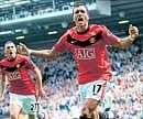 Manchester Uniteds Nani (right) celebrates with team-mate Federico Macheda after scoring against Tottenham Hotspur during their EPL match on Saturday. AFP