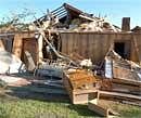 Damage to the bedroom of a home in Satartia, Miss., is seen, when a tornado struck destroying bedroom on Saturday. AP