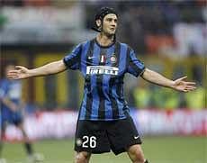 Inter Milan Romanian defender Cristian Chivu celebrates after scoring during a Serie A soccer match between Inter Milan and Atalanta, at the San Siro stadium in Milan on Saturday. AP