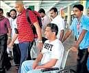 Passengers of an Emirates aircraft which made an emergency landing at the Nedumbasserry International Airport in Kochi on Sunday. PTI