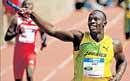 Usain Bolt celebrates after powering Jamaica to victory at the Penn Relays on Saturday. AP