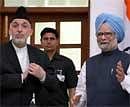 Prime Minister Manmohan Singh and Afghan President Hamid Karzai after their joint statement following Indo-Afghan delegation level talk in New Delhi on Monday. PTI