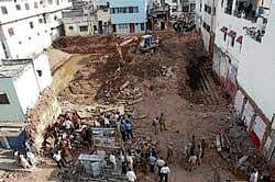Demolition of houses which were constructed on 300 years old kalyani of Someshwara temple in Ulsoor. dh photo