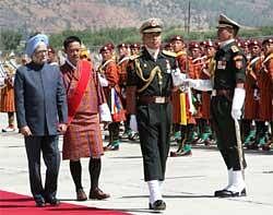 Prime Minister Manmohan Singh inspecting the guard of honour on his arrival at Paro Airport in Bhutan on Wednesday. PM will participate in the two-day 16th SAARC Summit. PTI