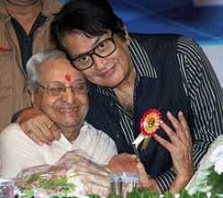 Veteran actors Pran and Manoj Kumar get cosy during the 141st birth anniversary celebration of the late Dadasaheb Phalke in Mumbai on Friday. PTI