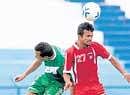 HASCs Jotin Singh (left) and Malabar Uniteds PU Vijesh Kumar vie for the ball in their I-League Second Division final round match on Friday. DH Photo