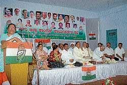 Opposition leader in Council Motamma speaking at district-level Congress party workers    convention in Madikeri on Friday. DH Photo