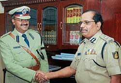 Seemanth Kumar Singh (Left) taking charge from IGP (Western Range) and In-Charge Police Commissioner Gopal B Hosur at the IGP office in Mangalore on Friday. dh photo