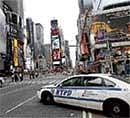 A police cruiser stands by at the scene where a crude bomb was planted at Times Square in New York. AFP