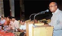 MLA Yogish Bhat speaking at Janaspandana programme held in Mangalore on Monday.  DH Photo
