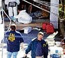 FBI agents remove evidence from a house in Bridgeport, Connecticut, on Tuesday. AP