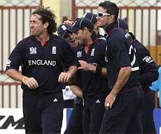 England cricketers celebrating the dismissal of Ireland's opener Paul Stirling during the World Twenty20 in Georgetown on Tuesday. The game was abandoned due to rain and with each team getting one point, England go through to the Super Eights for their superior net run-rate. AP