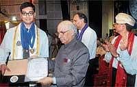 Governor Hans Raj Bharadwaj presenting a degree to a student at NITK convocation in Surathkal on Wednesday. DH Photo