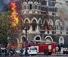 In this file photo, fire tenders try to douse fire at the ground and first floor of the Taj Hotel in South Mumbai during security personnels Operation Cyclone following the terror  attacks in November 2008. PTI