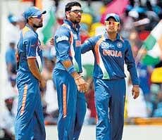 Crucial day: India need big efforts from Yusuf Pathan (left) , Yuvraj (centre) and Suresh Raina against Windies on Sunday. AFP