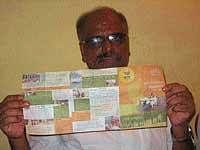 JD(S) State Vice President H T Rajendra displaying the  handbill, allegedly distributed by the BJP workers during election campaign, at a press meet in N R Pura on Saturday.