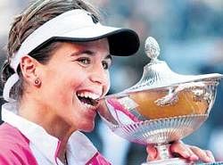 All Smiles: Spaniard Maria Jose Martinez Sanchez poses with the trophy after her win over Jelena Jankovic. AFP