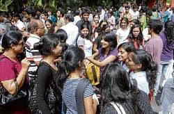 Students greet each other after appearing for the Common Law Admission Test at the National Law School of India University in Bangalore on Sunday. DH Photo