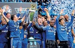 Champions: Chelsea players celebrate after recieving the EPL trophy on Sunday. AP