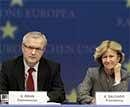 European Commissioner for Economic Affairs Olli Rehn, left, and Spanish Finance Minister Elena Salgado participate in a media conference during an emergency meeting of EU finance ministers in Brussels, Sunday, AP